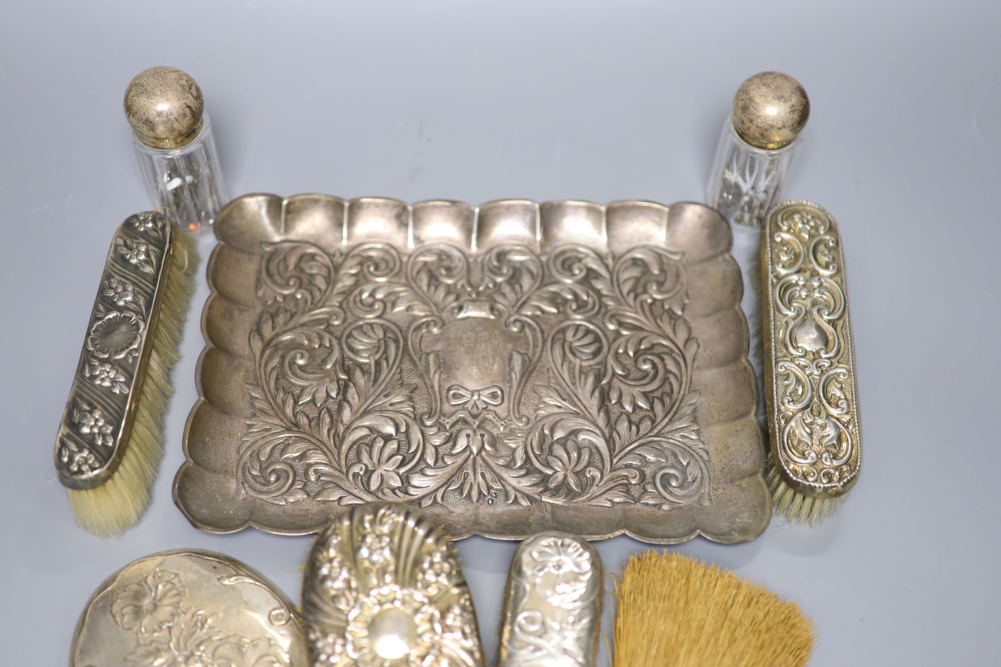 A Portuguese white metal dressing table tray(repairs), 28.2cm, gross 13oz & 8 other dressing table items.